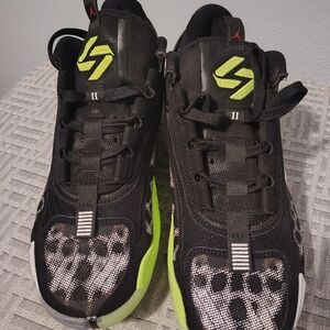 Black Sneakers with Neon Green Accents